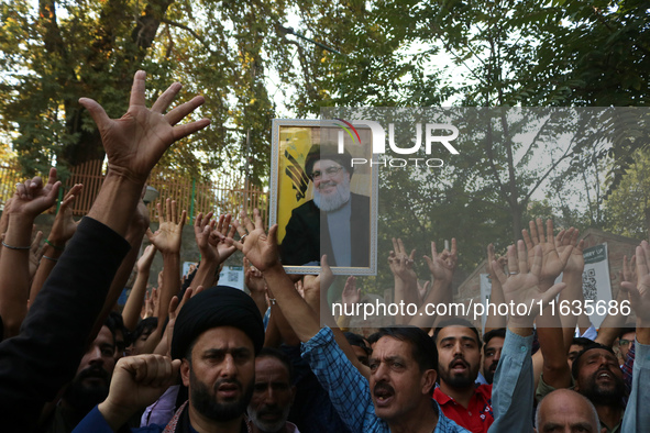 Kashmiri Shia Muslims shout slogans during a protest against Israel following the killing of Lebanon's Hezbollah leader Sayyed Hassan Nasral...