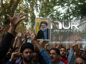 Kashmiri Shia Muslims shout slogans during a protest against Israel following the killing of Lebanon's Hezbollah leader Sayyed Hassan Nasral...