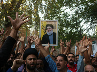 Kashmiri Shia Muslims shout slogans during a protest against Israel following the killing of Lebanon's Hezbollah leader Sayyed Hassan Nasral...