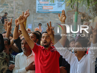 Kashmiri Shia Muslims shout slogans during a protest against Israel following the killing of Lebanon's Hezbollah leader Sayyed Hassan Nasral...