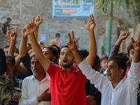 Kashmiri Shia Muslims shout slogans during a protest against Israel following the killing of Lebanon's Hezbollah leader Sayyed Hassan Nasral...