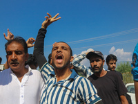 Kashmiri Shia Muslims shout slogans during a protest against Israel following the killing of Lebanon's Hezbollah leader Sayyed Hassan Nasral...