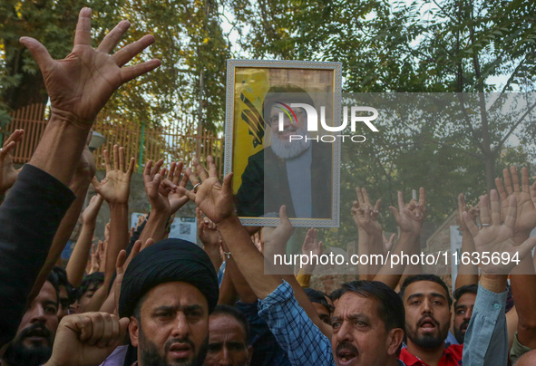 Kashmiri Shia Muslims shout slogans during a protest against Israel following the killing of Lebanon's Hezbollah leader Sayyed Hassan Nasral...