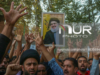 Kashmiri Shia Muslims shout slogans during a protest against Israel following the killing of Lebanon's Hezbollah leader Sayyed Hassan Nasral...