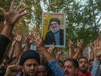 Kashmiri Shia Muslims shout slogans during a protest against Israel following the killing of Lebanon's Hezbollah leader Sayyed Hassan Nasral...