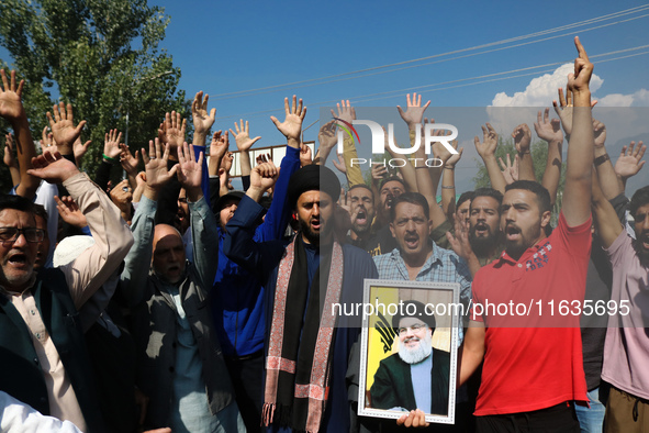 Kashmiri Shia Muslims shout slogans during a protest against Israel following the killing of Lebanon's Hezbollah leader Sayyed Hassan Nasral...