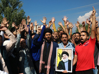 Kashmiri Shia Muslims shout slogans during a protest against Israel following the killing of Lebanon's Hezbollah leader Sayyed Hassan Nasral...