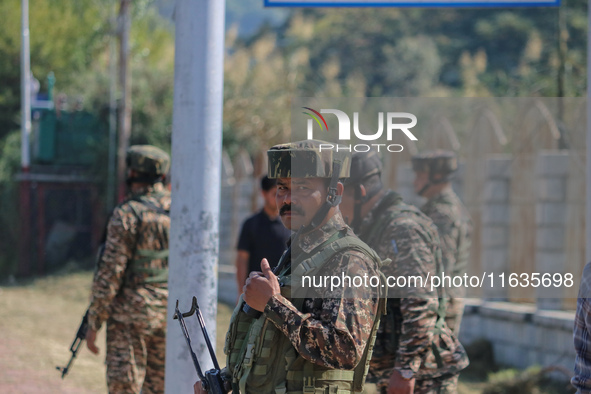 An Indian paramilitary soldier stands guard during a protest against Israel following the killing of Lebanon's Hezbollah leader Sayyed Hassa...