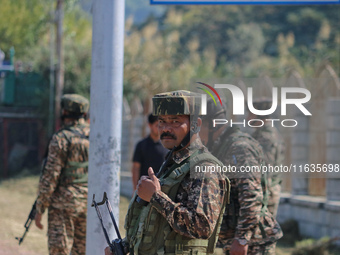 An Indian paramilitary soldier stands guard during a protest against Israel following the killing of Lebanon's Hezbollah leader Sayyed Hassa...