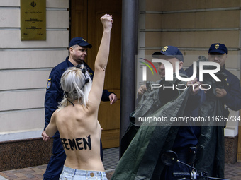 Members of the FEMEN Ukraine group stage a protest in front of the Iranian Embassy in Kyiv, Ukraine, on October 4, 2024, against the deliver...