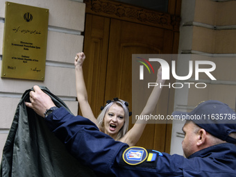 Members of the FEMEN Ukraine group stage a protest in front of the Iranian Embassy in Kyiv, Ukraine, on October 4, 2024, against the deliver...