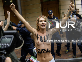 Members of the FEMEN Ukraine group stage a protest in front of the Iranian Embassy in Kyiv, Ukraine, on October 4, 2024, against the deliver...