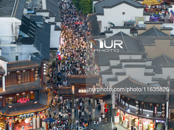 Tourists visit the Confucius Temple in Nanjing, China, on October 4, 2024. 