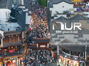 Tourists visit the Confucius Temple in Nanjing, China, on October 4, 2024. (