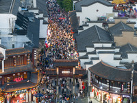 Tourists visit the Confucius Temple in Nanjing, China, on October 4, 2024. (