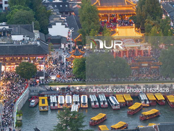 Tourists visit the Confucius Temple in Nanjing, China, on October 4, 2024. 