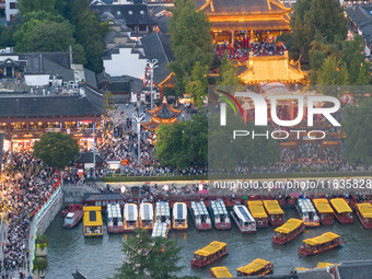 Tourists visit the Confucius Temple in Nanjing, China, on October 4, 2024. (