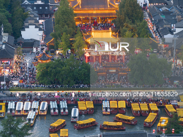 Tourists visit the Confucius Temple in Nanjing, China, on October 4, 2024. 