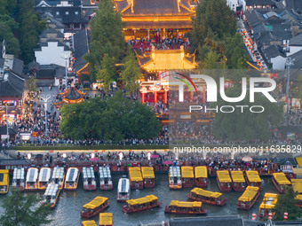 Tourists visit the Confucius Temple in Nanjing, China, on October 4, 2024. (