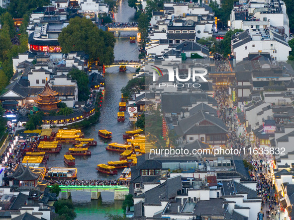 Tourists visit the Confucius Temple in Nanjing, China, on October 4, 2024. 