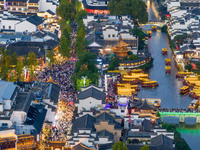 Tourists visit the Confucius Temple in Nanjing, China, on October 4, 2024. (