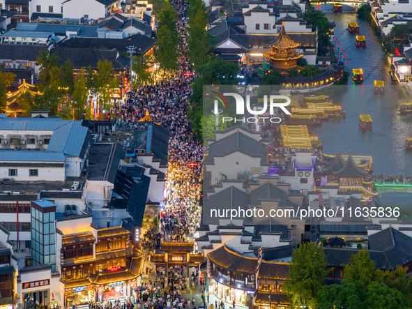 Tourists visit the Confucius Temple in Nanjing, China, on October 4, 2024. 