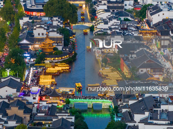 Tourists visit the Confucius Temple in Nanjing, China, on October 4, 2024. 