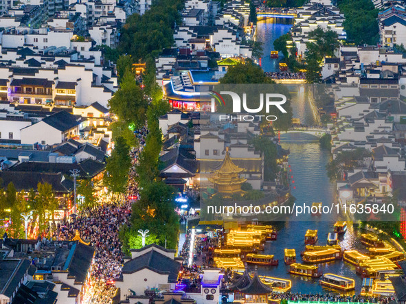 Tourists visit the Confucius Temple in Nanjing, China, on October 4, 2024. 