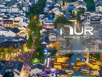 Tourists visit the Confucius Temple in Nanjing, China, on October 4, 2024. (