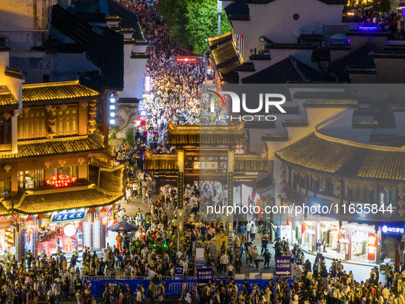 Tourists visit the Confucius Temple in Nanjing, China, on October 4, 2024. 