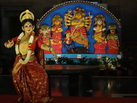 A dancer performs the ''Durgotsab'' dance dressed as goddess Durga ahead of the Durga Puja festival inside the historic Victoria Memorial mo...