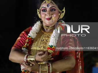 A dancer performs the ''Durgotsab'' dance dressed as goddess Durga ahead of the Durga Puja festival inside the historic Victoria Memorial mo...