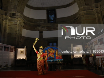 A dancer performs the ''Durgotsab'' dance dressed as goddess Durga ahead of the Durga Puja festival inside the historic Victoria Memorial mo...