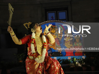 A dancer performs the ''Durgotsab'' dance dressed as goddess Durga ahead of the Durga Puja festival inside the historic Victoria Memorial mo...