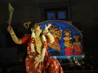 A dancer performs the ''Durgotsab'' dance dressed as goddess Durga ahead of the Durga Puja festival inside the historic Victoria Memorial mo...