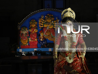 A dancer performs the ''Durgotsab'' dance dressed as goddess Durga ahead of the Durga Puja festival inside the historic Victoria Memorial mo...