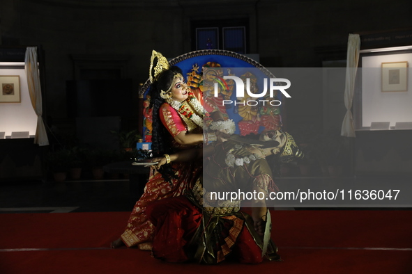 A performer performs the ''Durgotsab'' dance dressed as goddess Durga ahead of the Durga Puja festival inside the historic Victoria Memorial...