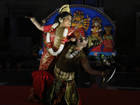 Dancers perform the ''Durgotsab'' dance dressed as goddess Durga and a demon ahead of the Durga Puja festival inside the historic Victoria M...