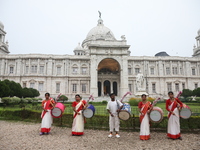 Drummers play their traditional Indian drums called ''Dhak'' in front of the historic Victoria Memorial monument, built during British colon...