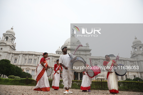 Drummers play their traditional Indian drums called ''Dhak'' in front of the historic Victoria Memorial monument, built during British colon...