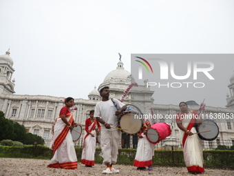 Drummers play their traditional Indian drums called ''Dhak'' in front of the historic Victoria Memorial monument, built during British colon...