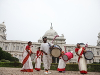 Drummers play their traditional Indian drums called ''Dhak'' in front of the historic Victoria Memorial monument, built during British colon...