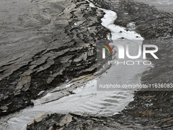 Several thousand dead fish are found following the emptying of the Collanges dam in Saint Michel d'Aurance in Ardeche, France, on October 4,...