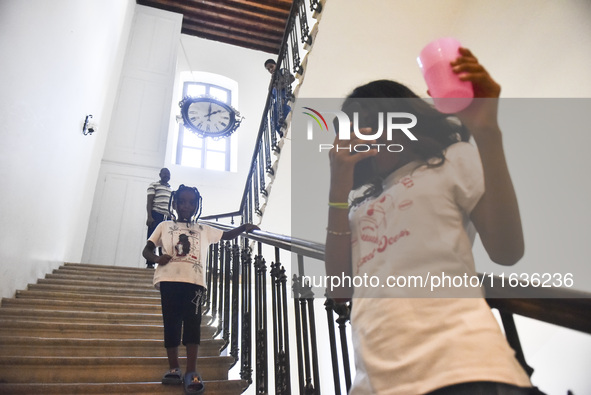 Migrant workers arrive at the Saint Joseph Jesuites Fathers Church, which is turned into a shelter to house families fleeing their homes as...