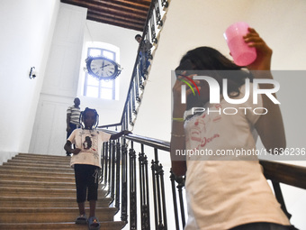 Migrant workers arrive at the Saint Joseph Jesuites Fathers Church, which is turned into a shelter to house families fleeing their homes as...