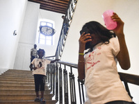 Migrant workers arrive at the Saint Joseph Jesuites Fathers Church, which is turned into a shelter to house families fleeing their homes as...