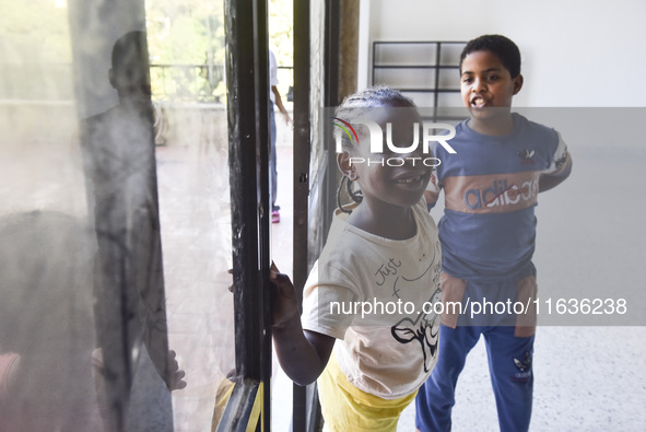 Migrant workers arrive at the Saint Joseph Jesuites Fathers Church, which is turned into a shelter to house families fleeing their homes as...