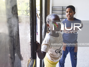 Migrant workers arrive at the Saint Joseph Jesuites Fathers Church, which is turned into a shelter to house families fleeing their homes as...