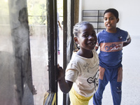 Migrant workers arrive at the Saint Joseph Jesuites Fathers Church, which is turned into a shelter to house families fleeing their homes as...