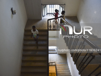 Migrant workers arrive at the Saint Joseph Jesuites Fathers Church, which is turned into a shelter to house families fleeing their homes as...